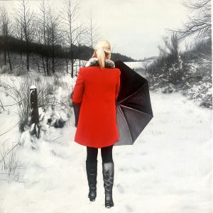 Red coat on a winter path